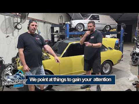 Nugget Garage video thumbnail with two people beside a yellow car